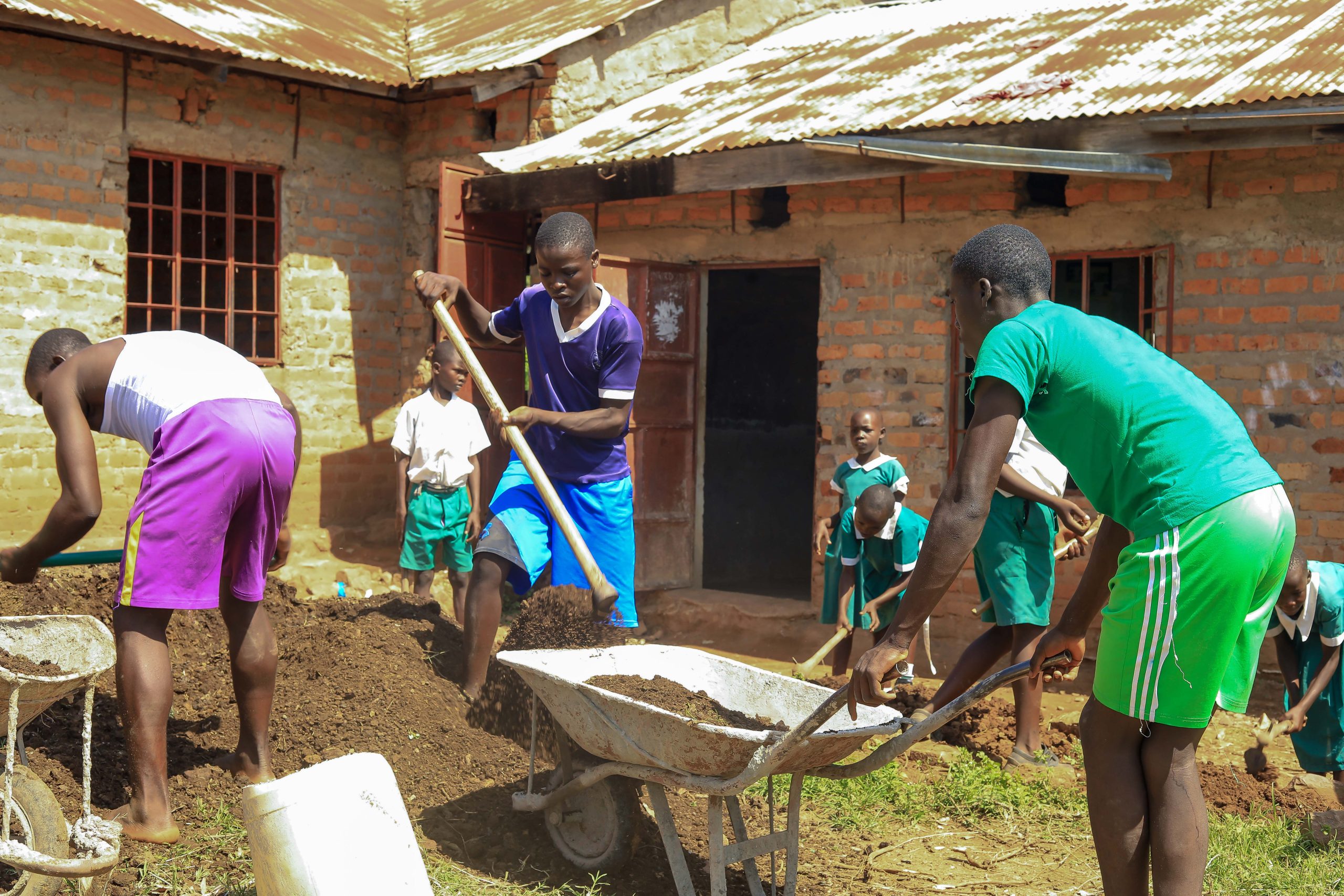 Students building compost and practicing soil regeneration
