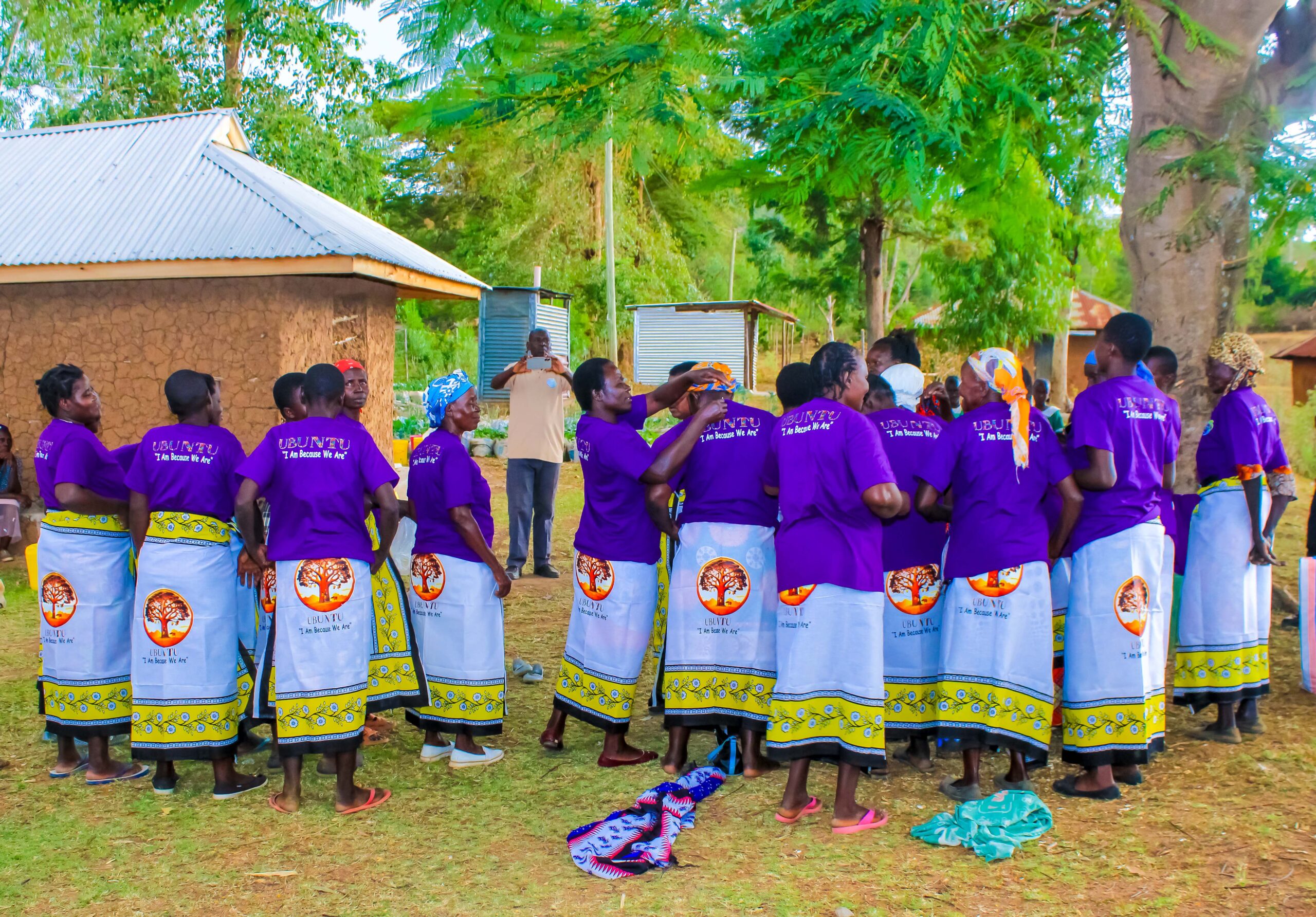 Angiro women's group receiving t-shirts and lesos