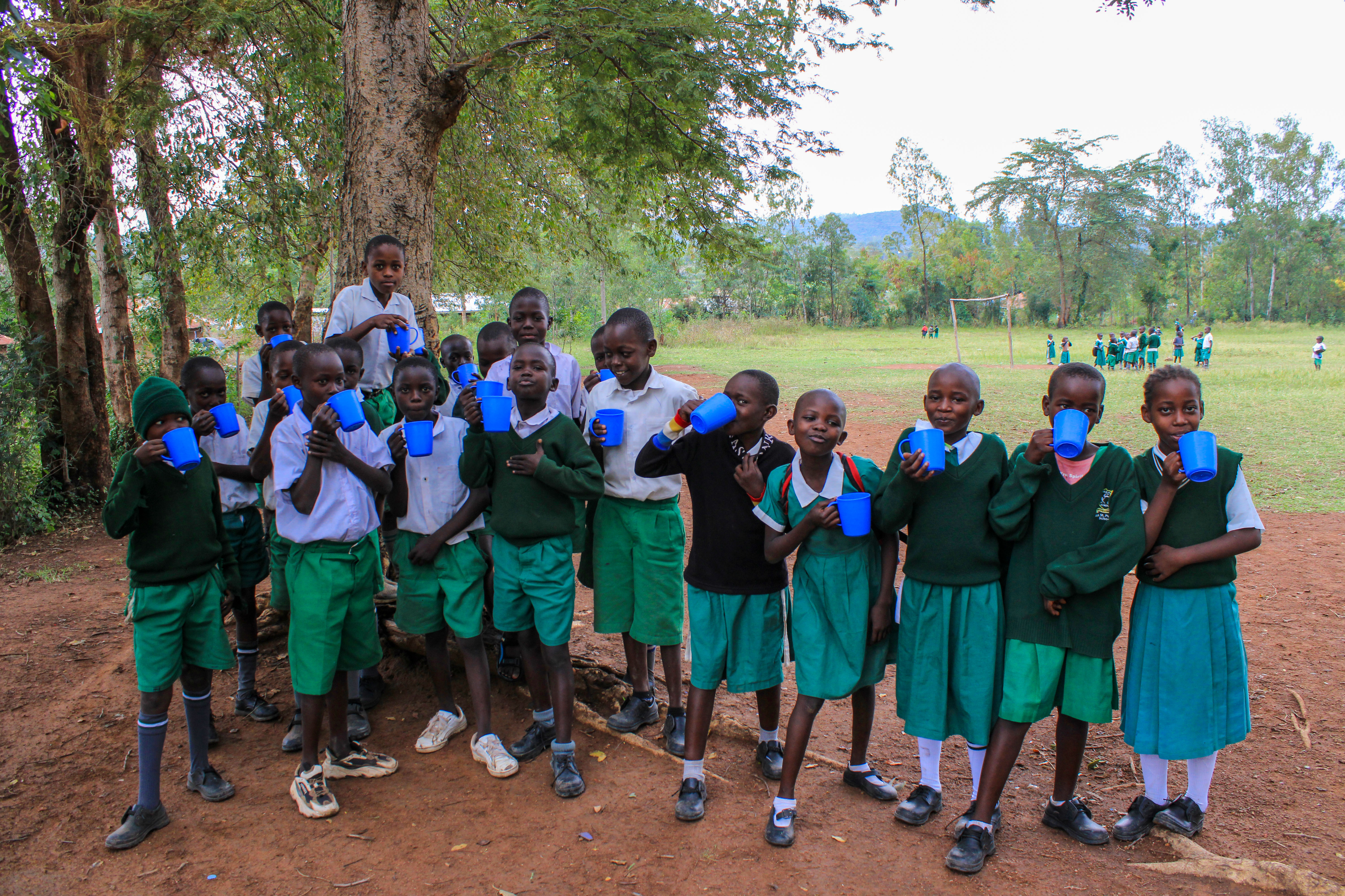 Pupils at Angiro Comprehensive School eating porridge before class
